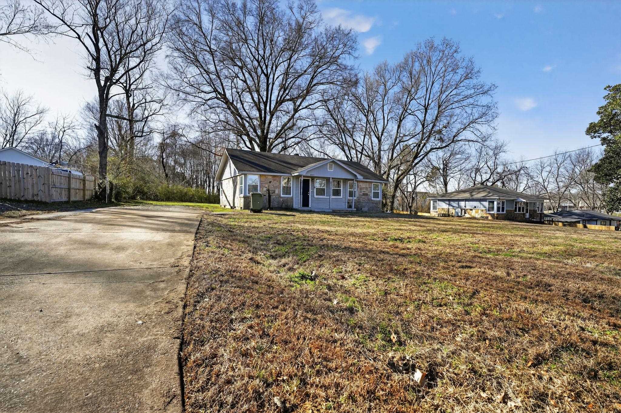 4043 Clearpool Circle Road Memphis, TN 38118 - Photo 2 of 33 a view of a yard with a large tree