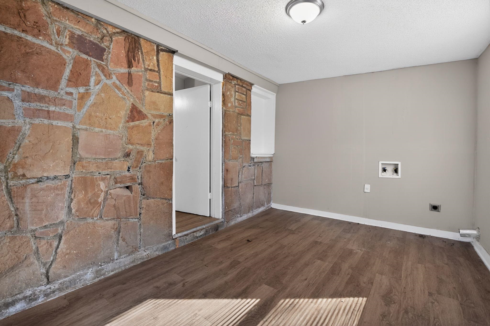 4043 Clearpool Circle Road Memphis, TN 38118 - Photo 22 of 33 a view of an empty room with wooden floor and a window