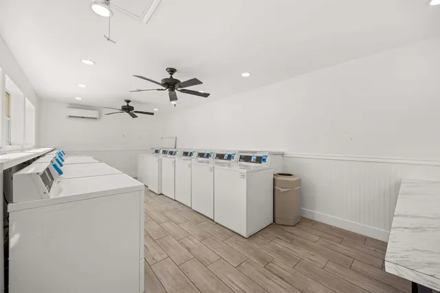 a living room with fireplace furniture and a chandelier