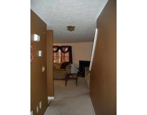 30 Caspian Way, Unit 30 Fitchburg, MA 01420 - Photo 2 of 10 a view of livingroom with furniture and rug
