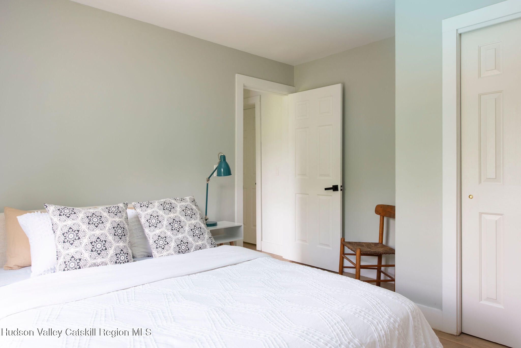 31 Laurel Hollow Road Kerhonkson, NY 12446 - Photo 25 of 47 a bedroom with a bed and a chair