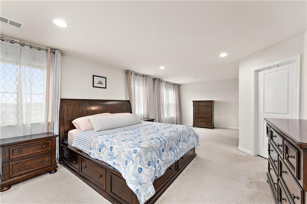 817 Oneida Circle Mars, PA 16046 - Photo 26 of 50 a bedroom with a large bed and a dresser