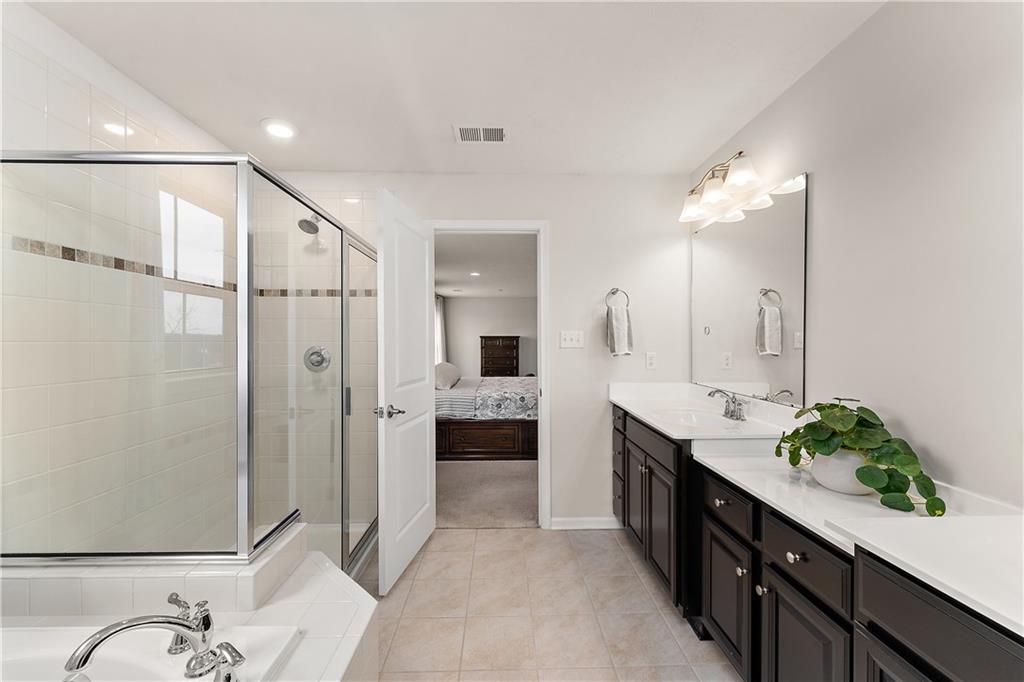 817 Oneida Circle Mars, PA 16046 - Photo 28 of 50 a spacious bathroom with a double vanity sink mirror and shower