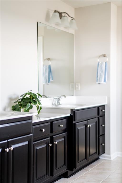 817 Oneida Circle Mars, PA 16046 - Photo 29 of 50 a bathroom with a granite countertop sink a mirror and a potted plant