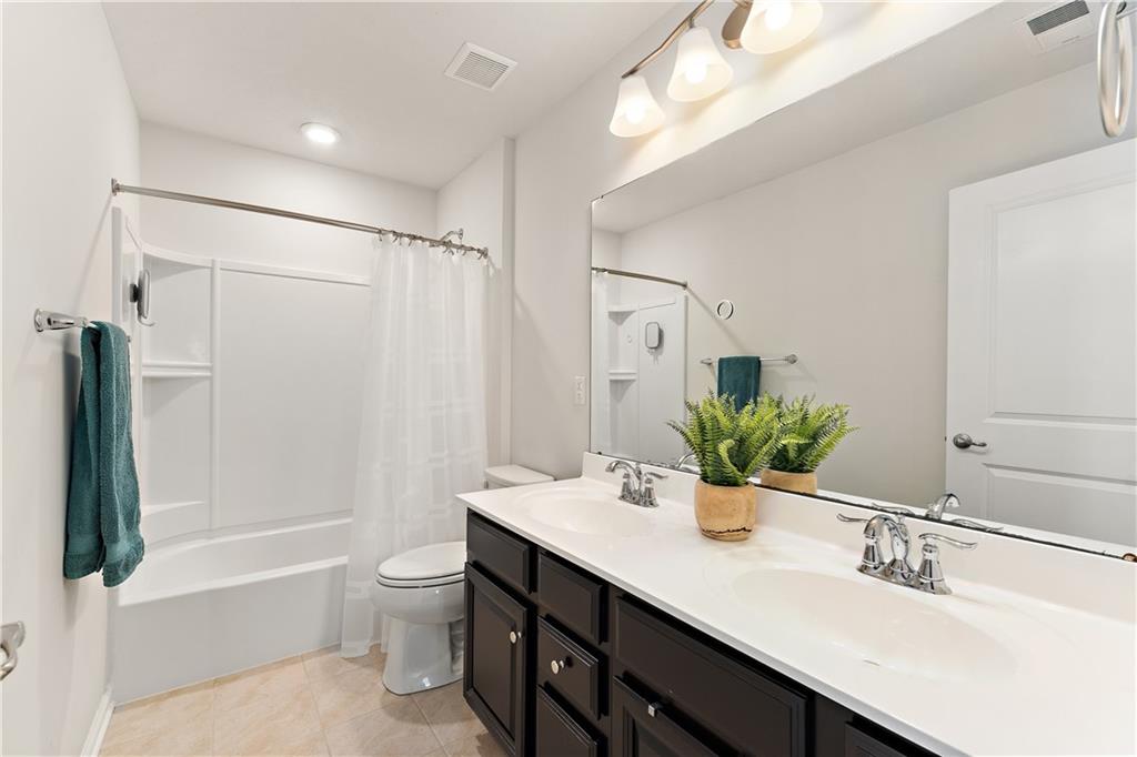 817 Oneida Circle Mars, PA 16046 - Photo 33 of 50 a bathroom with a double vanity sink toilet and shower