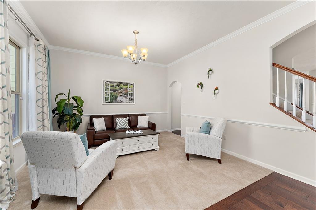 817 Oneida Circle Mars, PA 16046 - Photo 9 of 50 a living room with furniture flowerpot and wooden floor