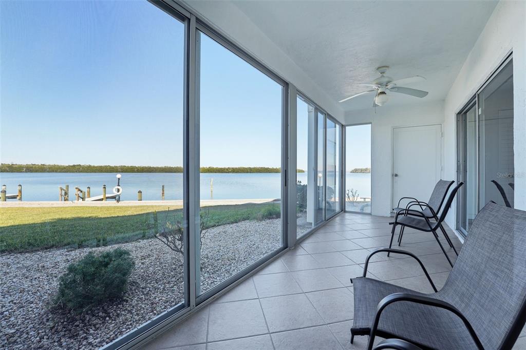 4440 Exeter Drive, Unit 106 Longboat Key, FL 34228 - Photo 17 of 26 a view of a livingroom with furniture and dinning table