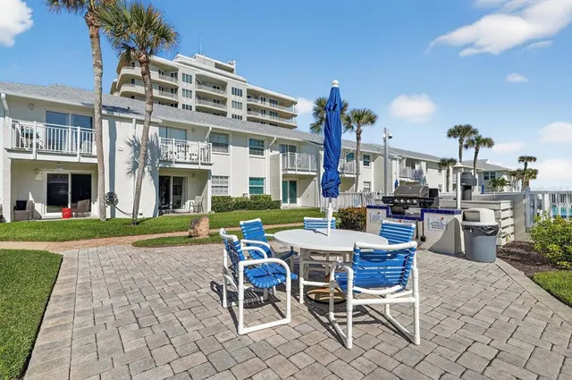 a view of a building with sitting area