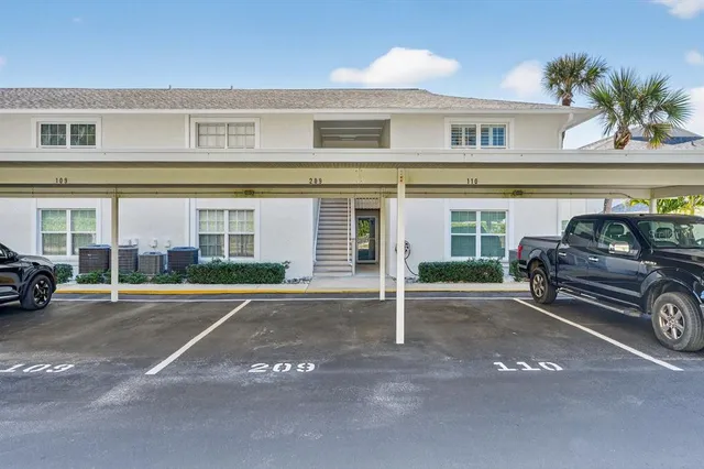 a view of a car parked front of a house