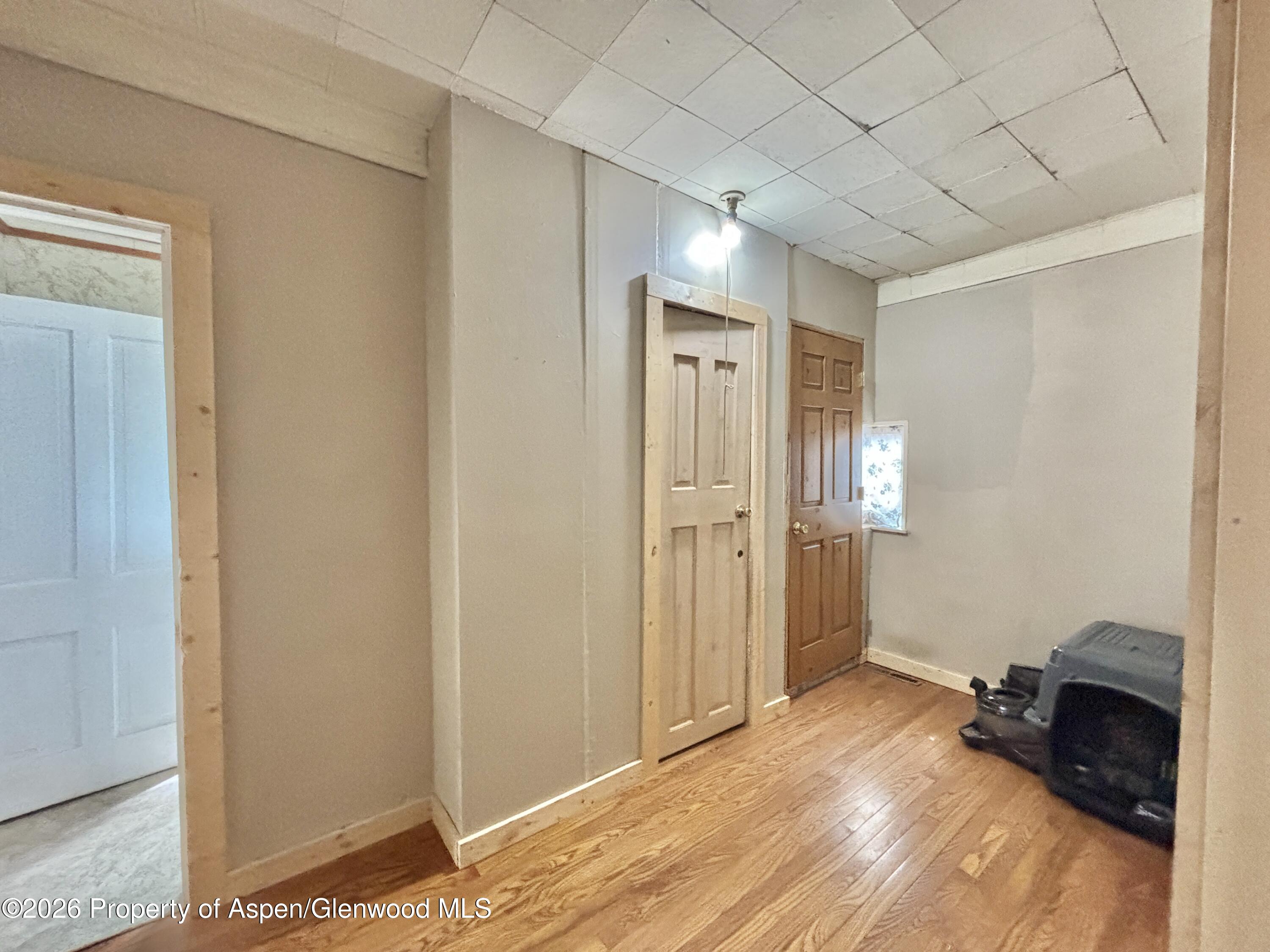 744 Market Street Meeker, CO 81641 - Photo 12 of 20 a view of a livingroom with wooden floor and closet