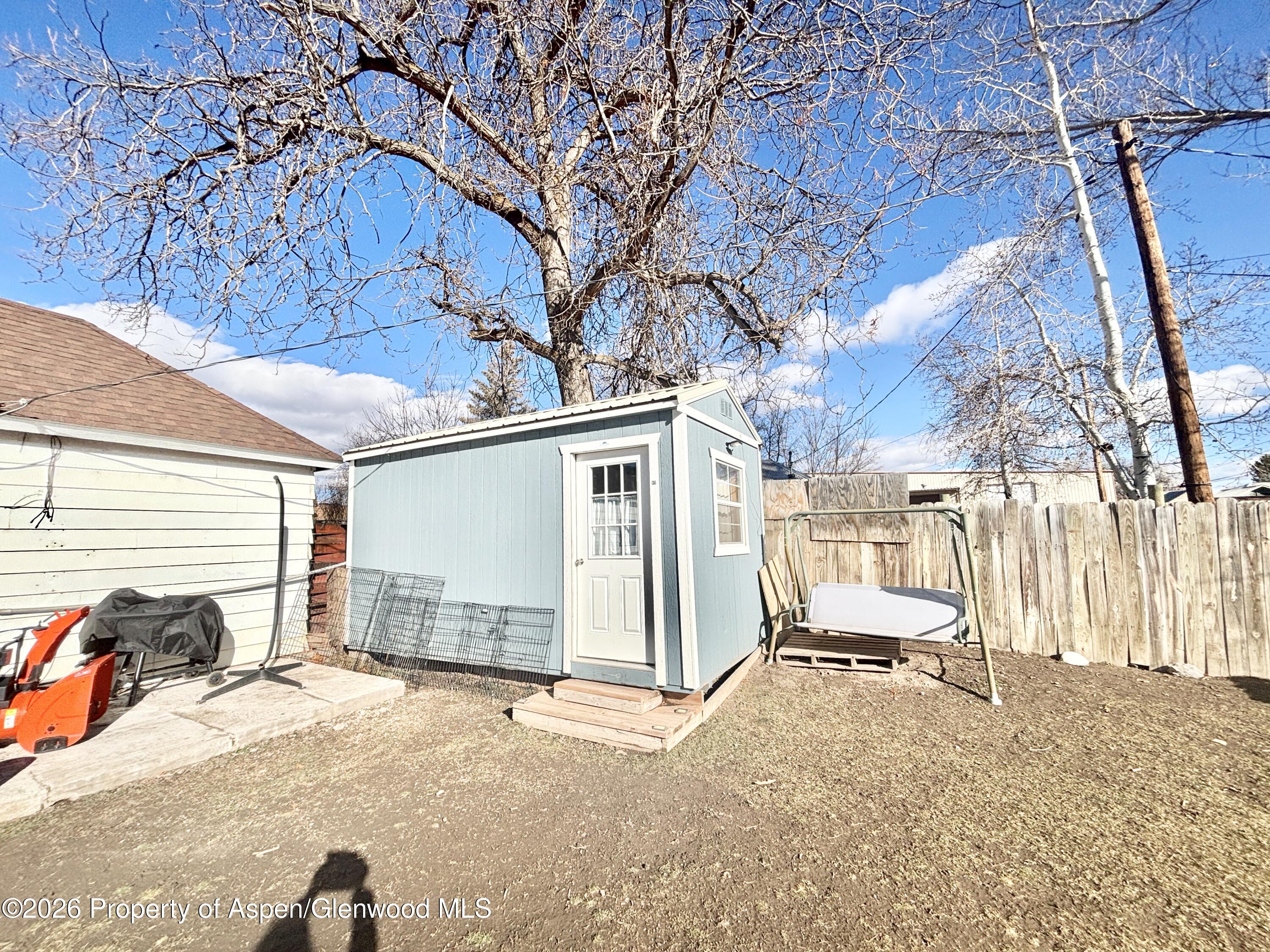 744 Market Street Meeker, CO 81641 - Photo 14 of 17 a view of a backyard with a snow