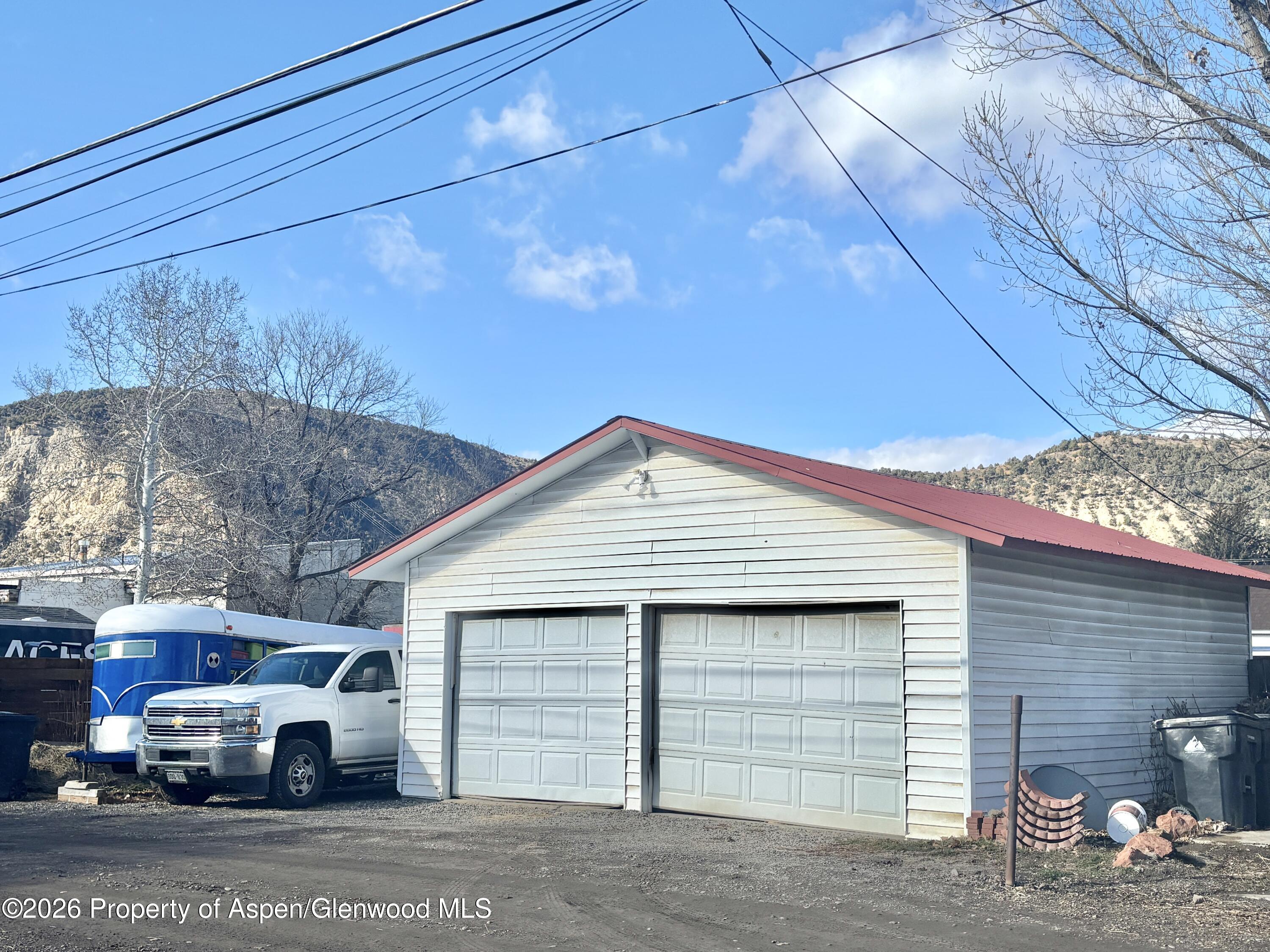 744 Market Street Meeker, CO 81641 - Photo 18 of 20 a front view of a house with a yard