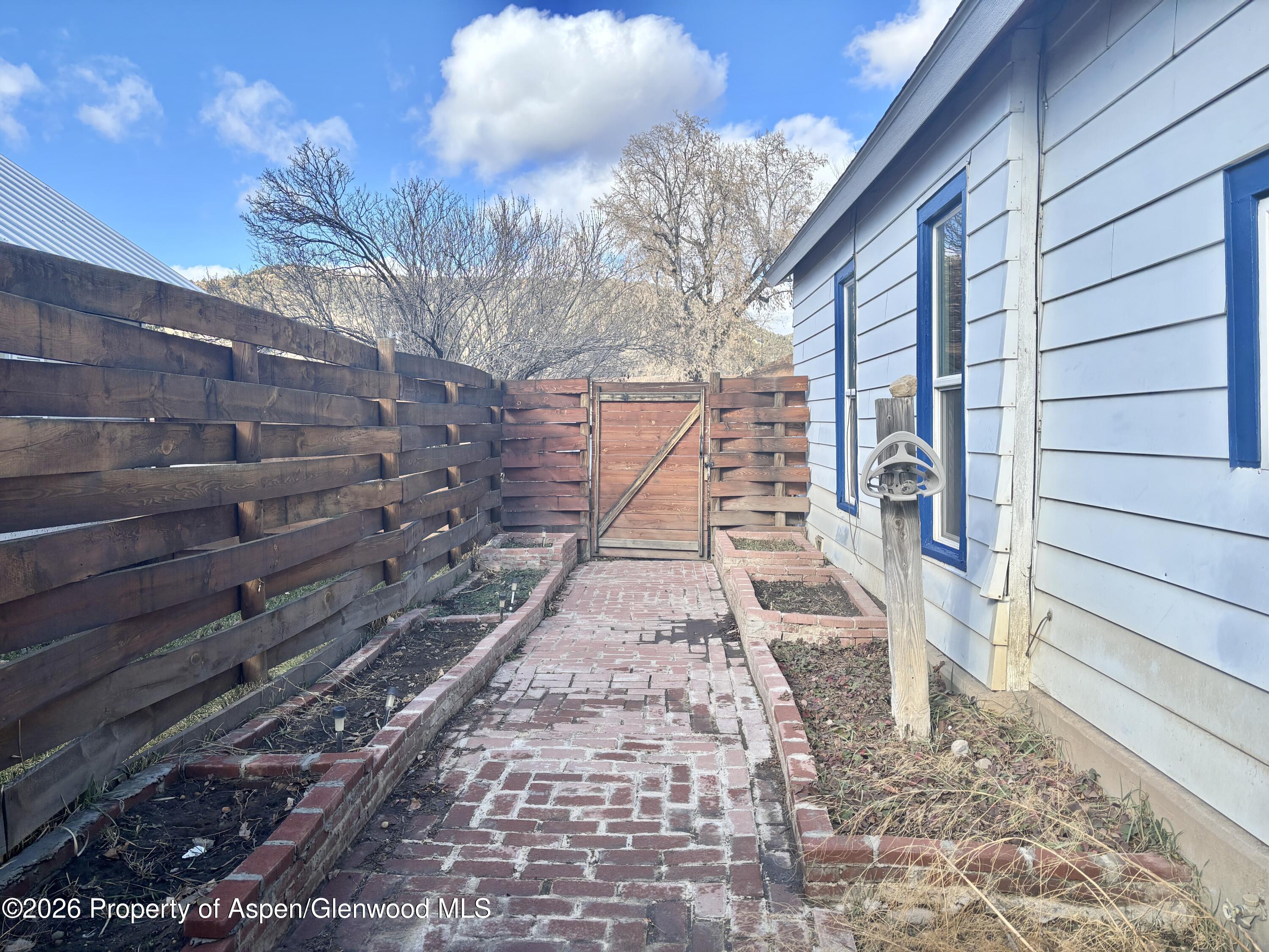 744 Market Street Meeker, CO 81641 - Photo 19 of 20 a pathway of a house with a yard