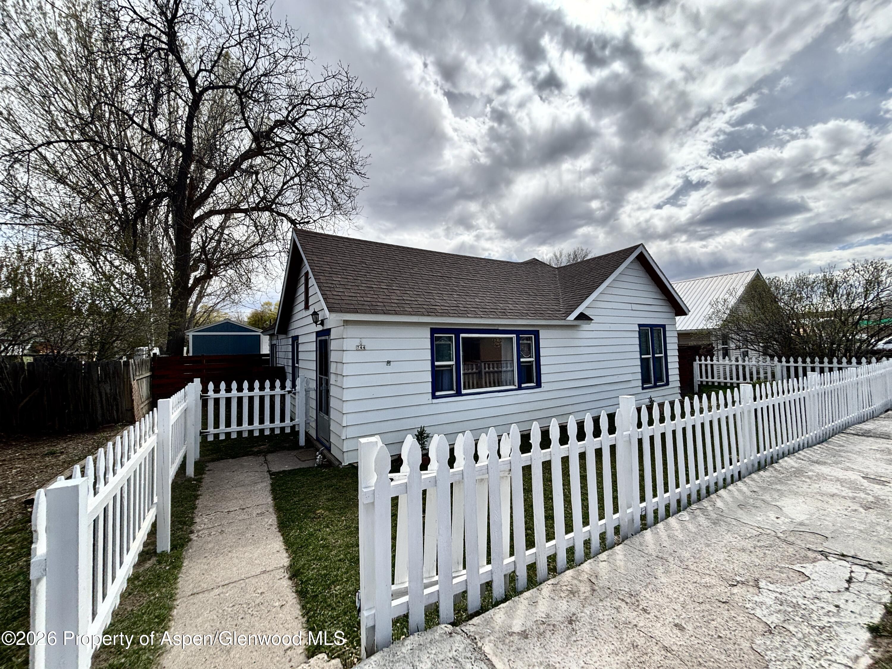 744 Market Street Meeker, CO 81641 - Photo 20 of 20 a front view of house with wooden fence