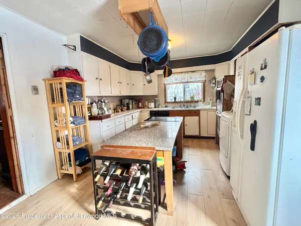 a view of a dining area with furniture window and wooden floor