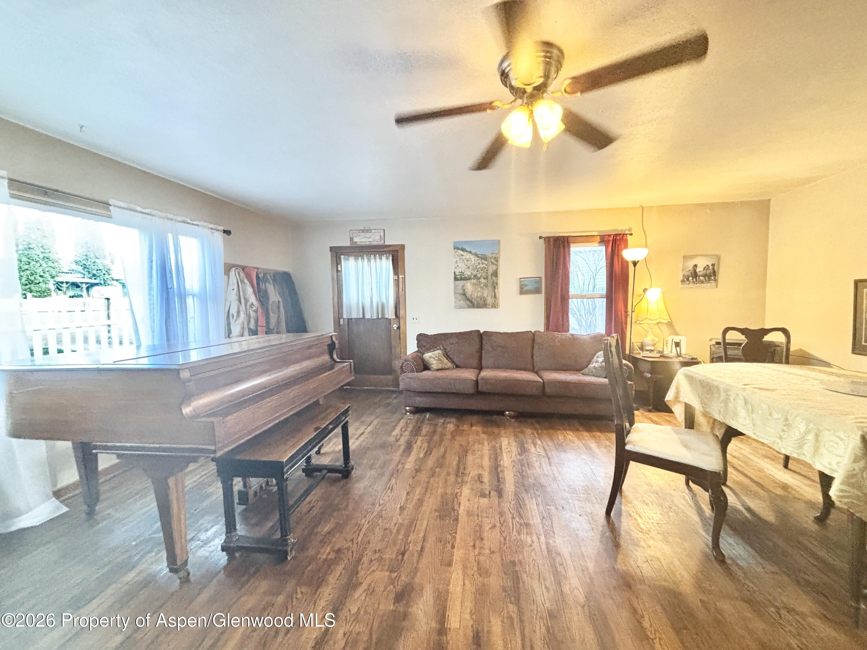 744 Market Street Meeker, CO 81641 - Photo 5 of 17 a living room with furniture and a wooden floor