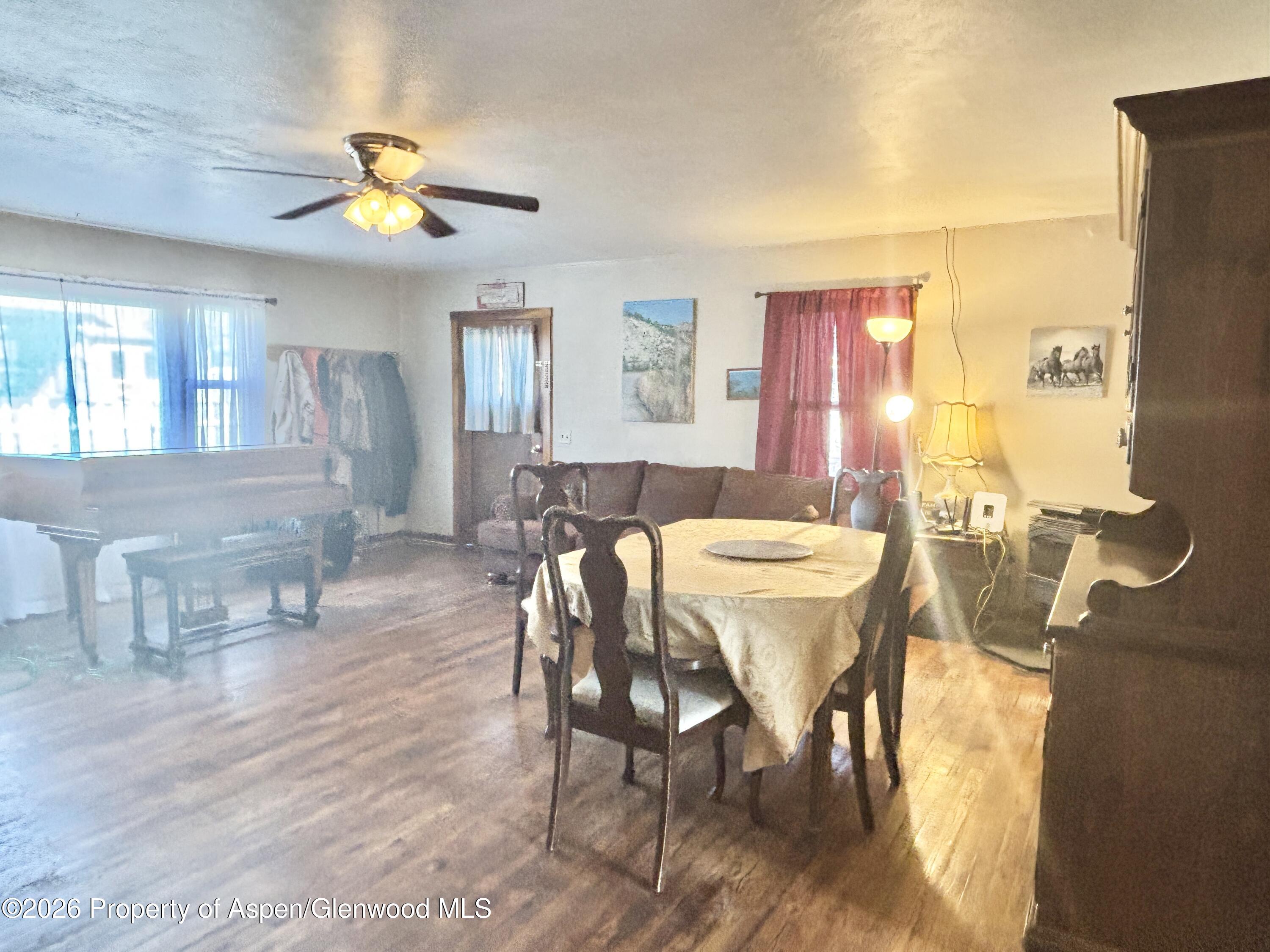 744 Market Street Meeker, CO 81641 - Photo 6 of 17 a view of a dining room with furniture and chandelier
