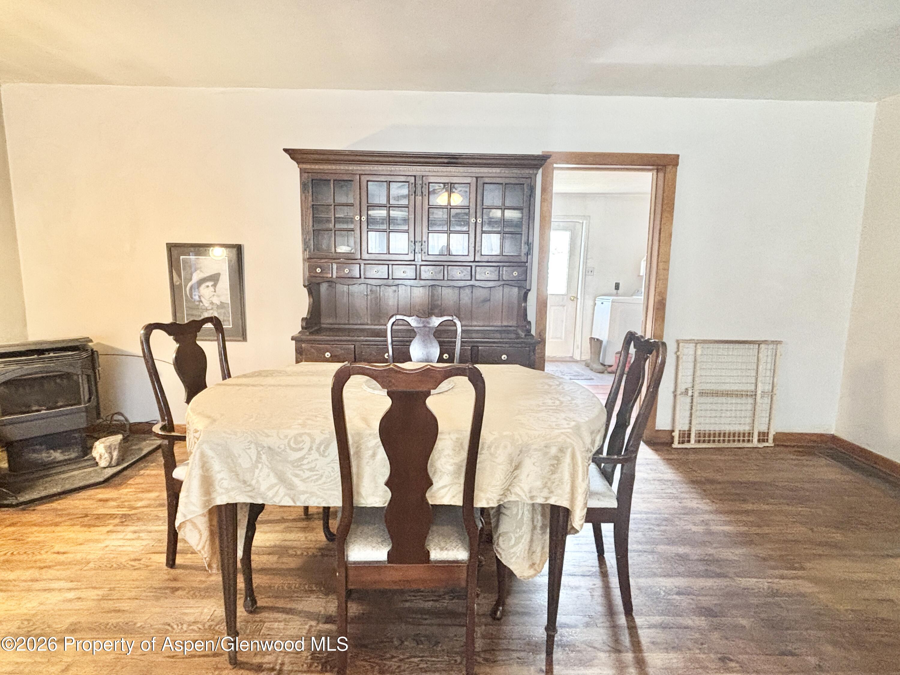 744 Market Street Meeker, CO 81641 - Photo 7 of 17 a view of a dining room with furniture window and wooden floor