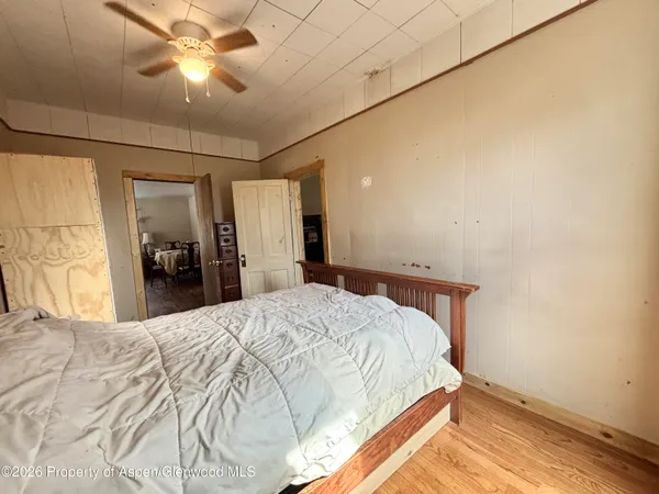 a view of workspace with furniture window and wooden floor