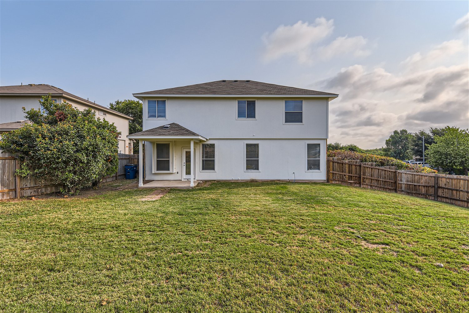 115 Killian Loop Hutto, TX 78634 - Photo 13 of 14 A private, fenced yard provides ample space for outdoor enjoyment behind this residence.