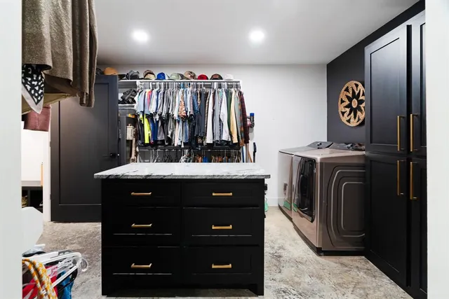 a bathroom with a sink a vanity and a mirror