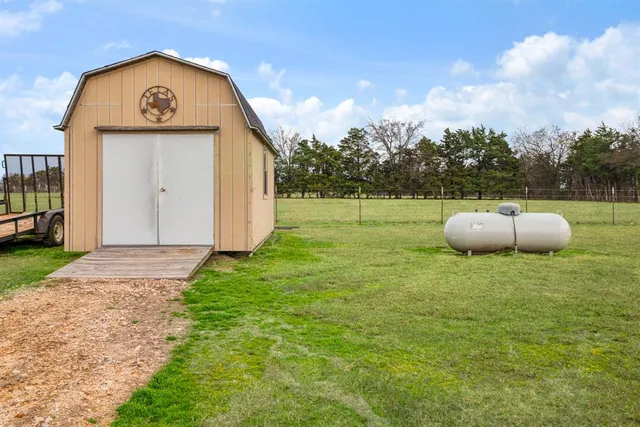 a house with swimming pool in front of it