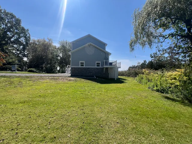 a swimming pool with trees in the background