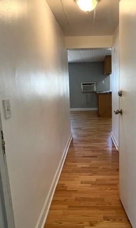 5209 South Leclaire Avenue, Unit 3B Chicago, IL 60638 - Photo 2 of 8 a view of a hallway with wooden floor