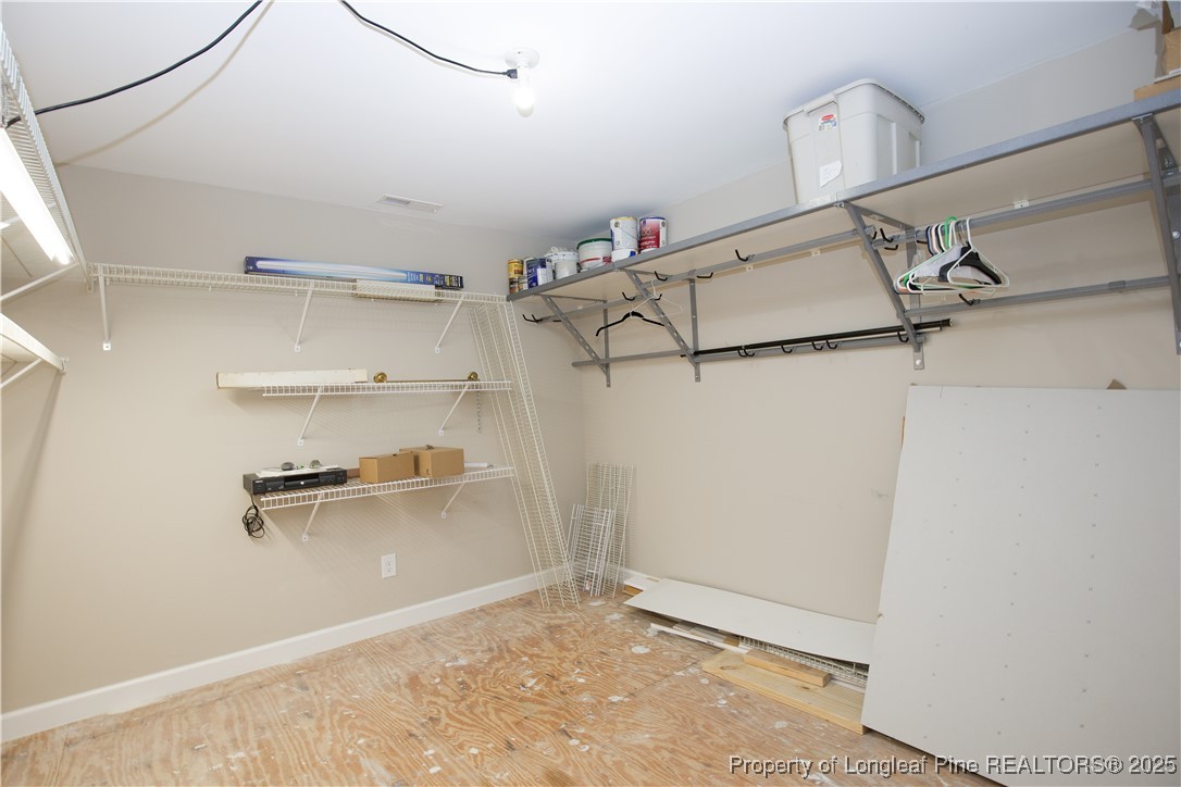 175 Knoll Road Southern Pines, NC 28387 - Photo 40 of 50 a view of a room with racks on the wall