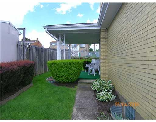 182 William Circle McKees Rocks, PA 15136 - Photo 3 of 18 Yard/Garden. Covered side porch with easy access from Kitchen.