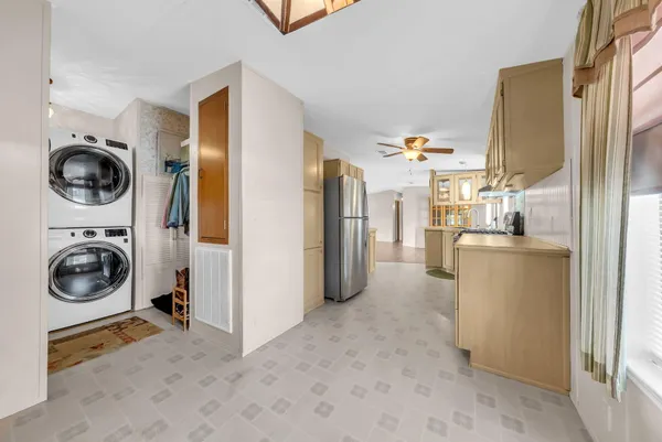 a view of a kitchen and utility room