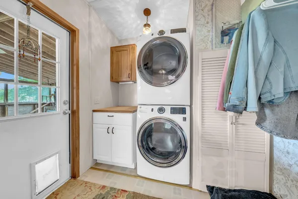 a view of a hallway with washer and dryer