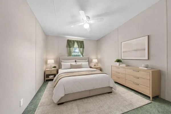 a bedroom with a bed and a dresser