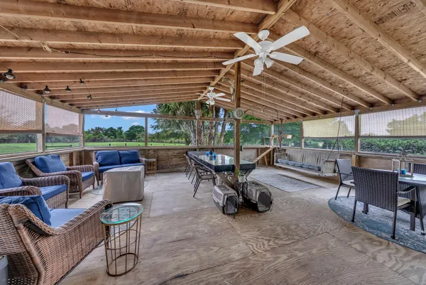 a view of a patio with table and chairs
