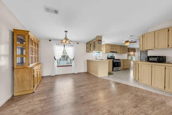 a kitchen with cabinets and window