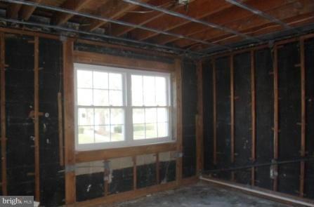 1981 Addison Road South, Unit 1981 District Heights, MD 20747 - Photo 9 of 11 a view of an empty room with wooden floor and a window