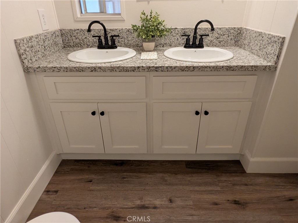 881 North Lake Street, Unit 357 Hemet, CA 92544 - Photo 15 of 29 a bathroom with sink and mirror