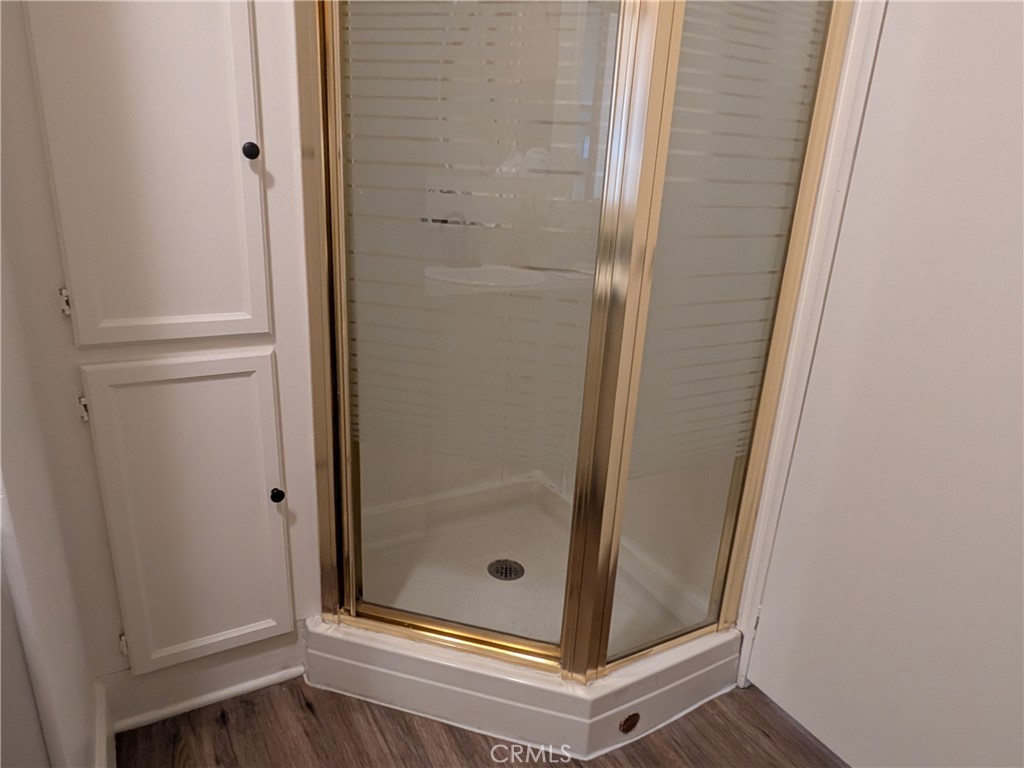 881 North Lake Street, Unit 357 Hemet, CA 92544 - Photo 16 of 29 a bathroom with a glass door shower