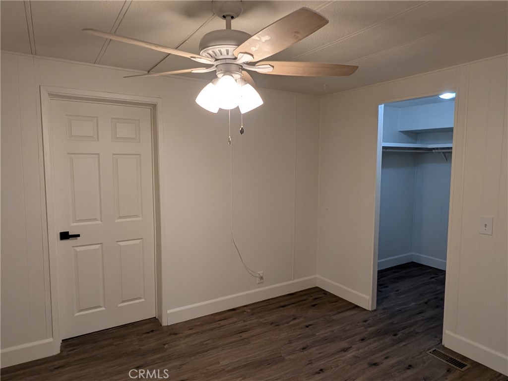 881 North Lake Street, Unit 357 Hemet, CA 92544 - Photo 20 of 29 wooden floor in an empty room with a mirror