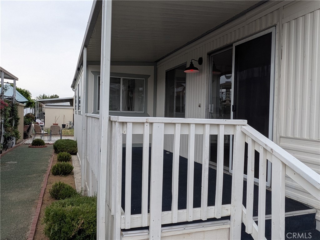 881 North Lake Street, Unit 357 Hemet, CA 92544 - Photo 3 of 29 a view of a house with backyard and porch