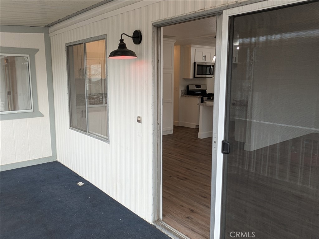 881 North Lake Street, Unit 357 Hemet, CA 92544 - Photo 5 of 29 a view of a hallway with wooden floor and closet