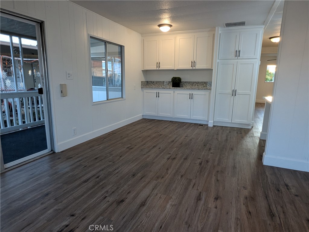 881 North Lake Street, Unit 357 Hemet, CA 92544 - Photo 10 of 29 a view of a kitchen with wooden floor and a window
