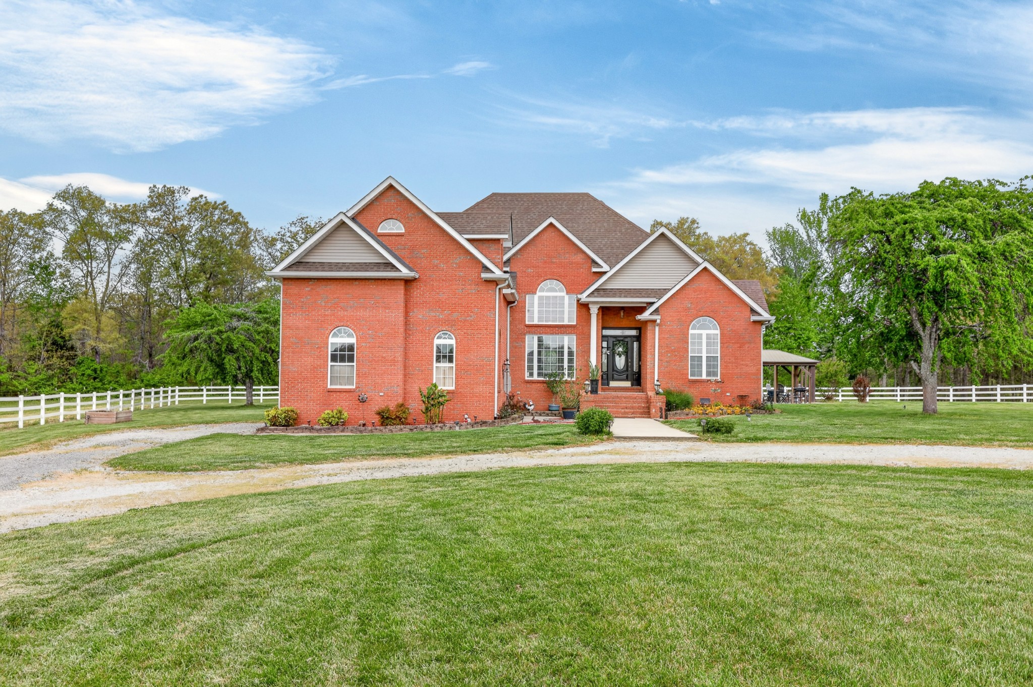 a front view of a house with a yard