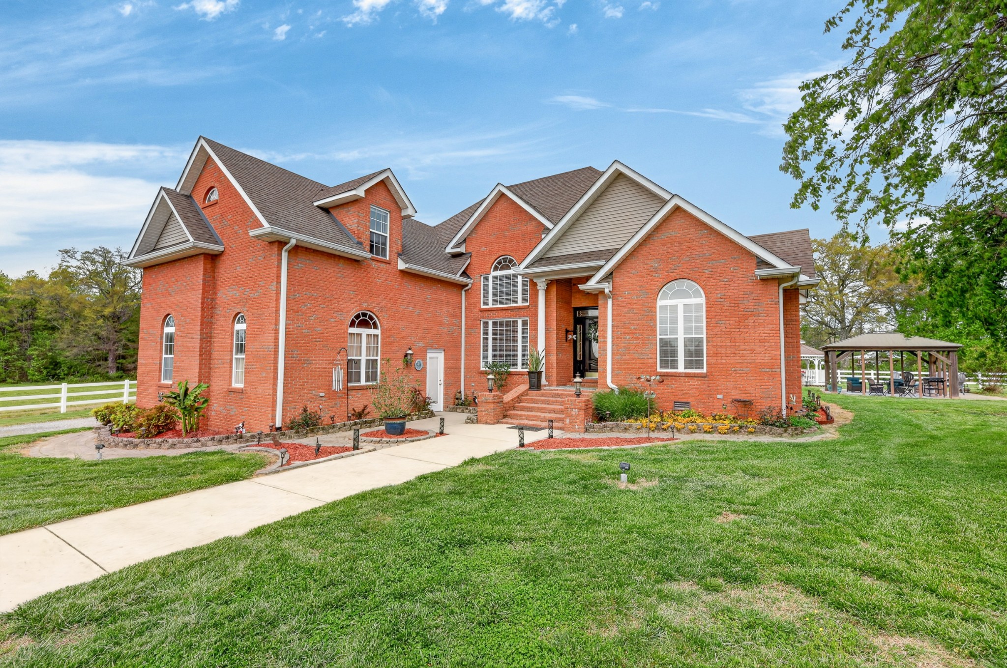 2015 Spry Road Bradyville, TN 37026 - Photo 2 of 77 a front view of a house with a yard and trees
