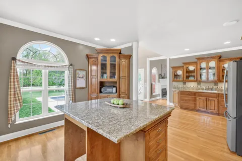 a bedroom with a bed and a dresser in it