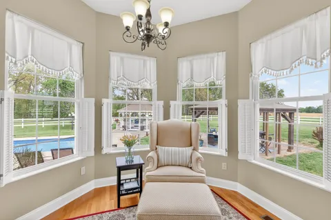 a living room with kitchen island granite countertop furniture and a fireplace