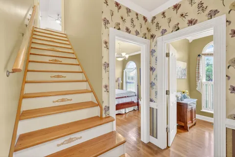 a roof deck with couch and chairs