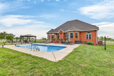 a view of an outdoor space pool patio and outdoor seating