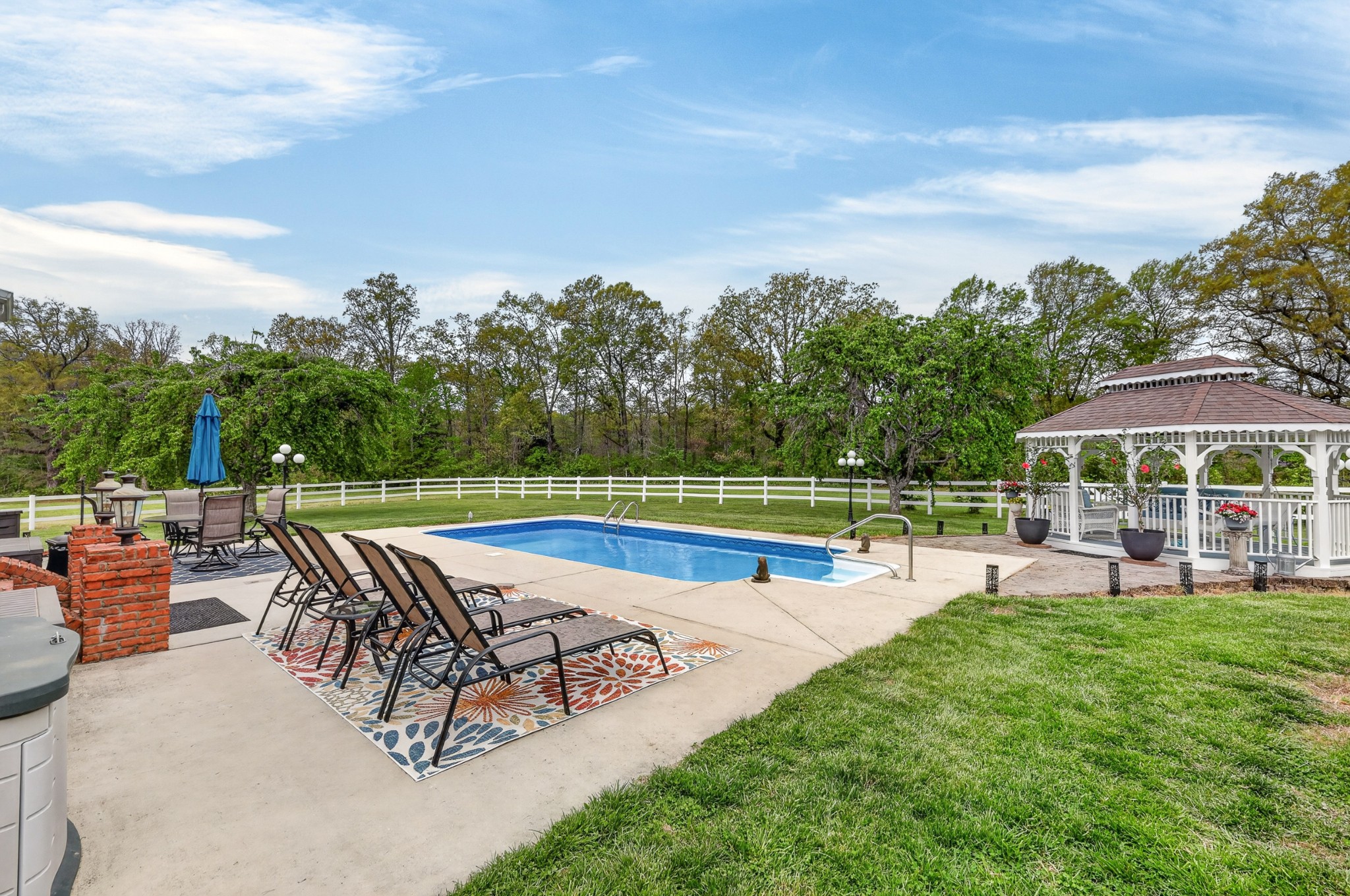2015 Spry Road Bradyville, TN 37026 - Photo 48 of 77 a view of a swimming pool and lounge chairs in back yard of the house