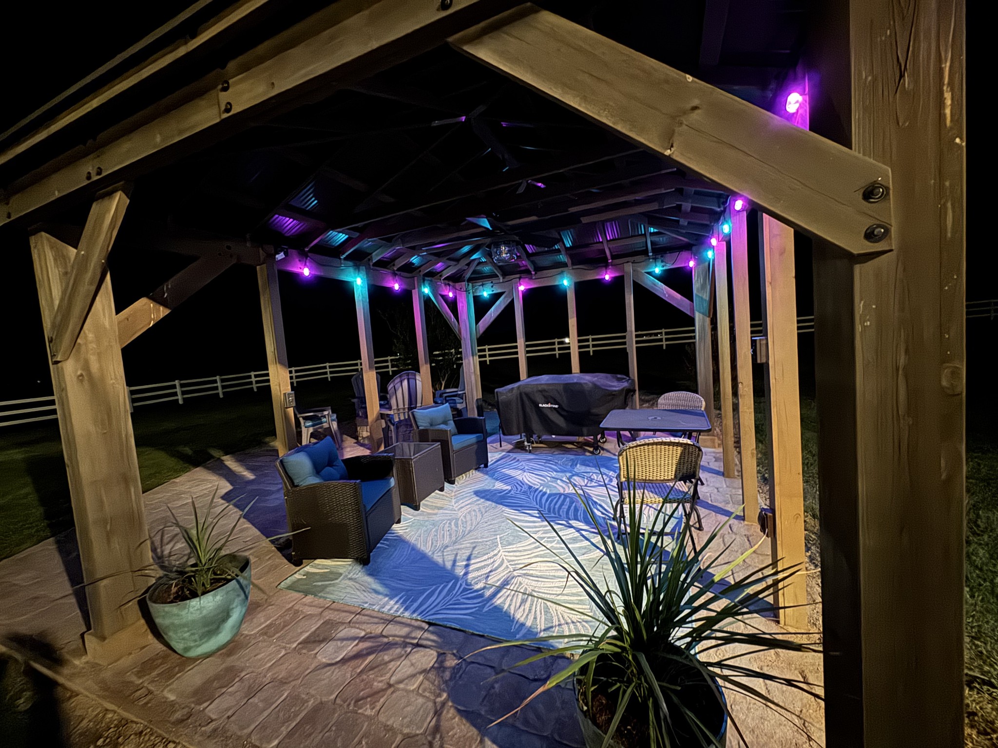 2015 Spry Road Bradyville, TN 37026 - Photo 50 of 77 a view of a porch with dining table and chairs under an umbrella